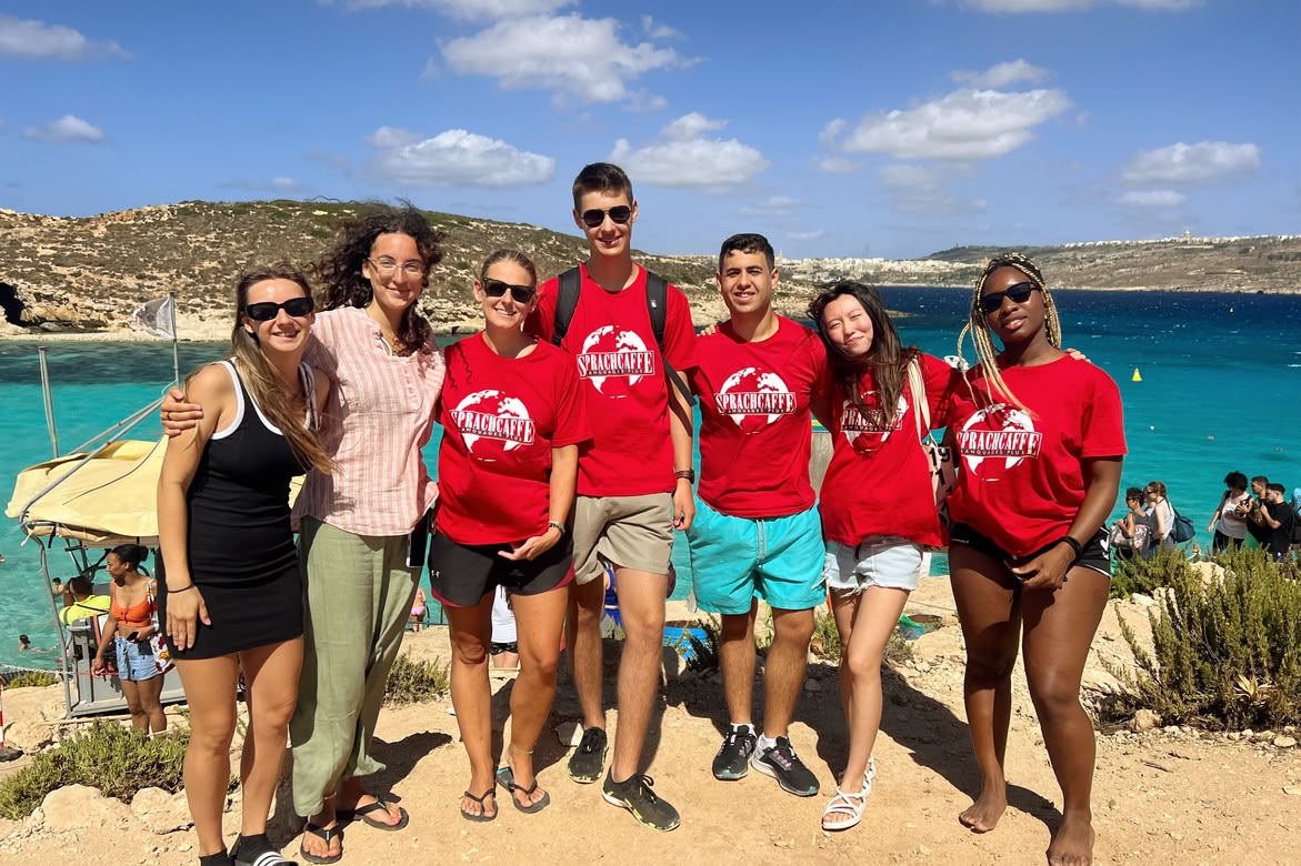 Sprachcaffe group posing at Comino’s Blue Lagoon.