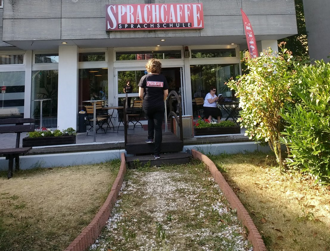 Take a cool picture infront of Sprachcaffe Languages Plus