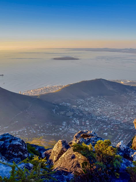 Aerial view of Cape Town, South Africa, with Lion’s Head and Table Mountain at sunset.