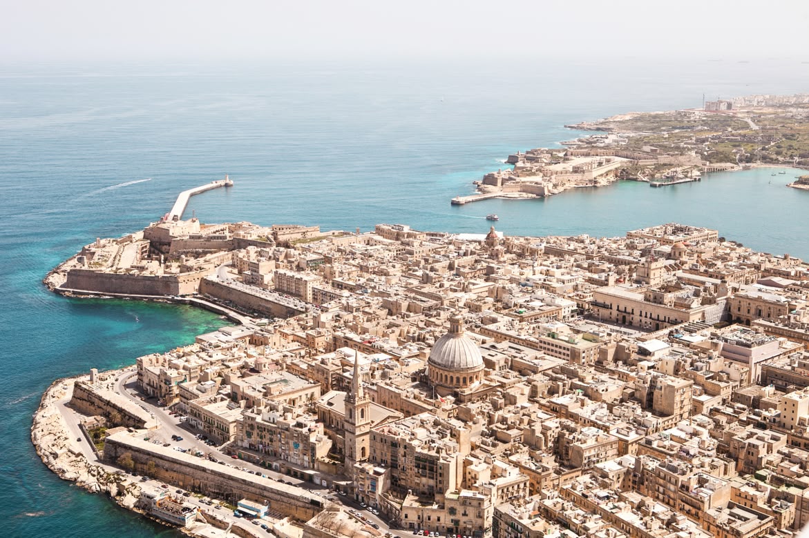 Detailed aerial view of Valletta with its dome and narrow historic streets.